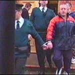 Kieran McLaughlin being led from court in November 2000 during an arms case in which he was jailed for 18 years